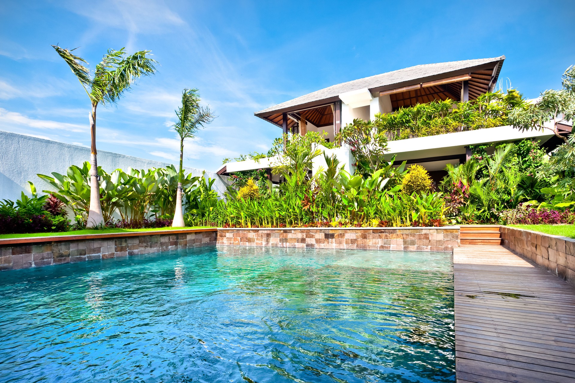 Modern swimming pool shining with the sunlight